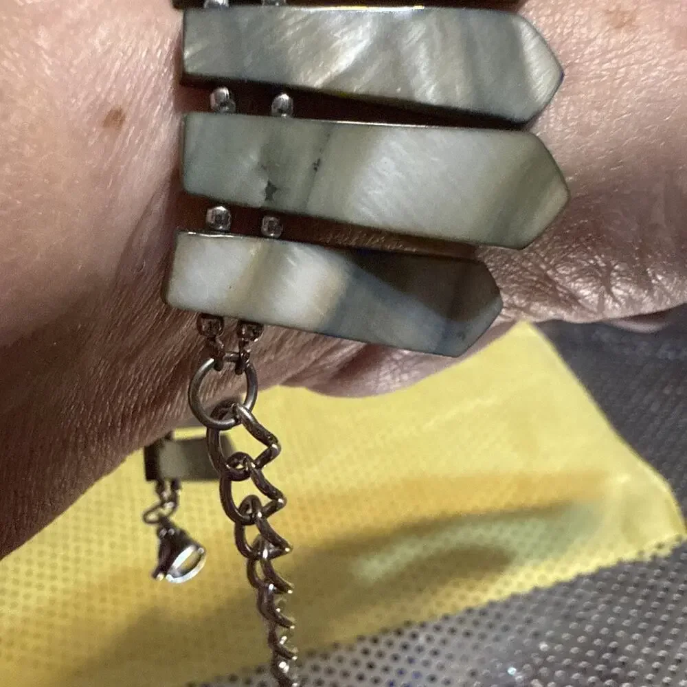Bracelet made of grey, possibly mother-of-pearl or shell, dagger or leaf-shaped